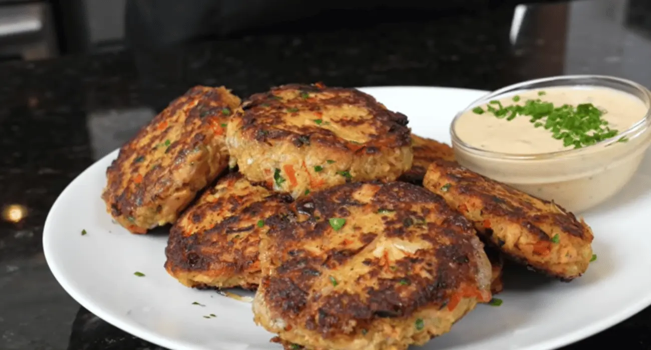 Salmon patties cooked to perfection, demonstrating tips to keep them from falling apart.