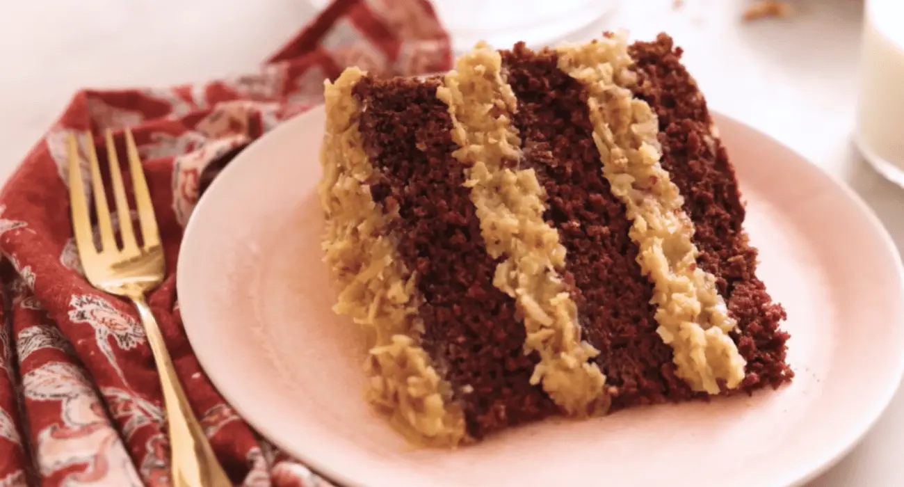 Close-up of a slice of Marmalade Café German Chocolate Cake with coconut-pecan frosting