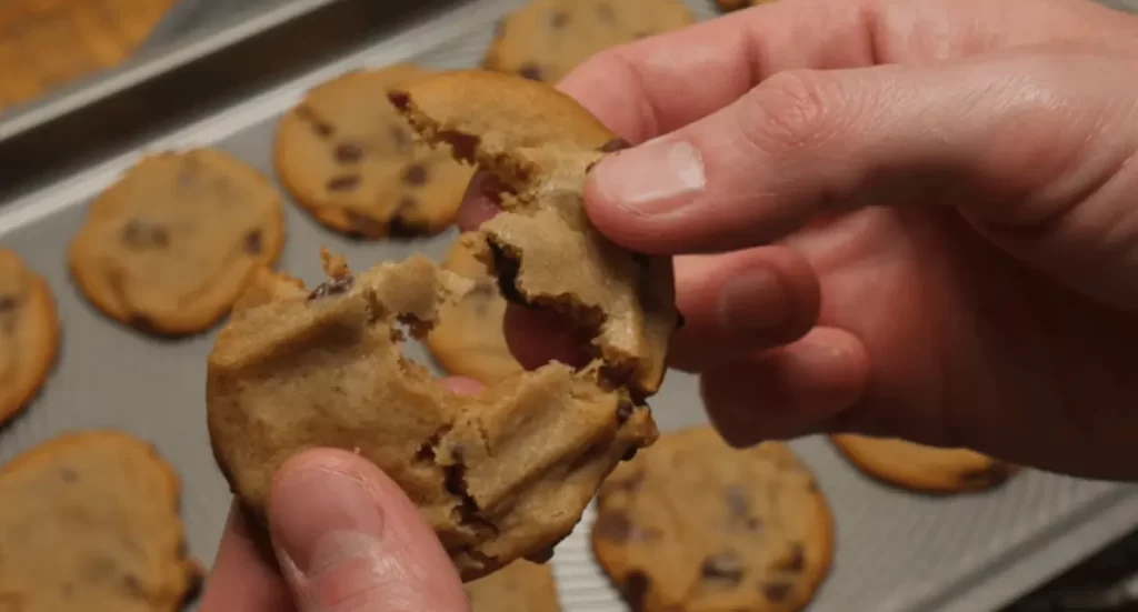 Nestlé Toll House chocolate chips scattered on a baking sheet