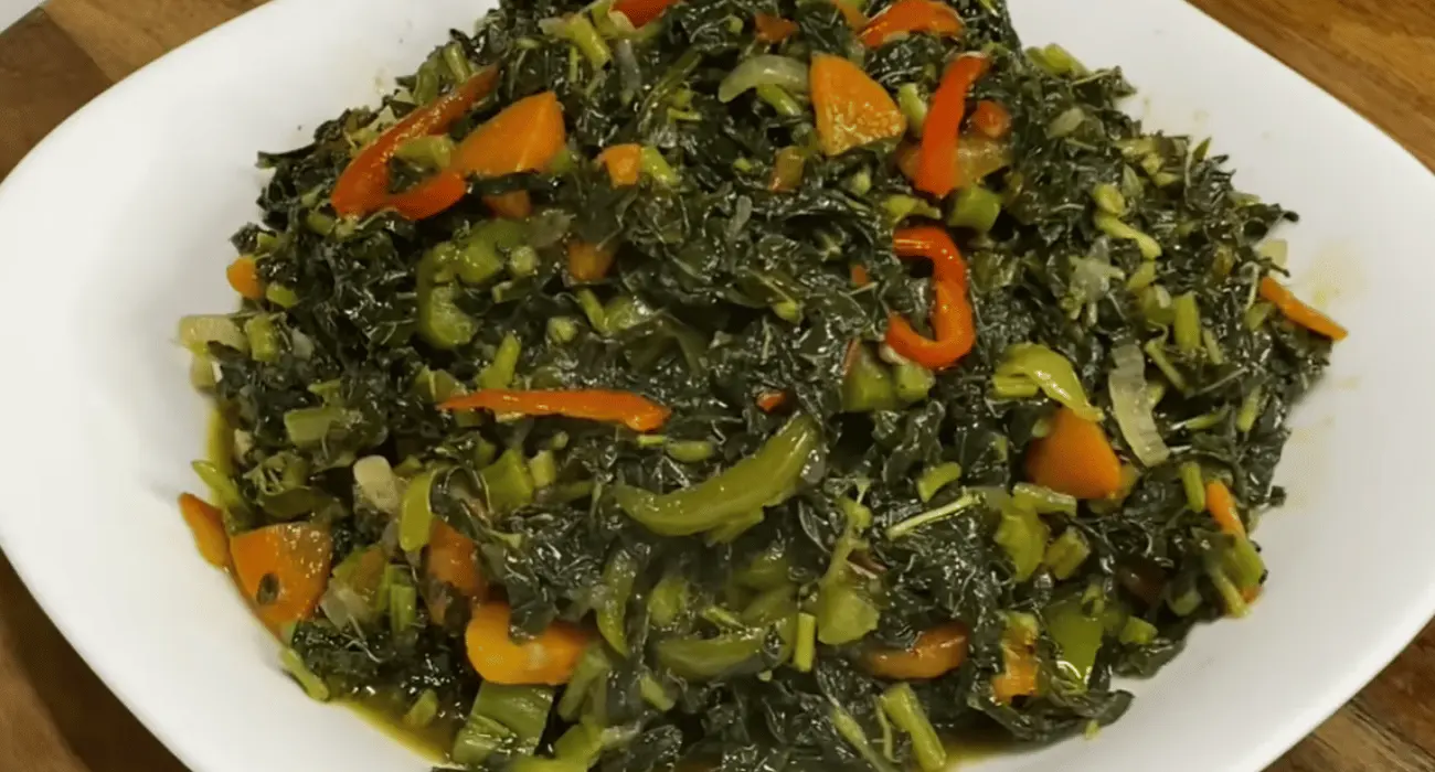 Traditional Caribbean calilu dish served with rice and peas