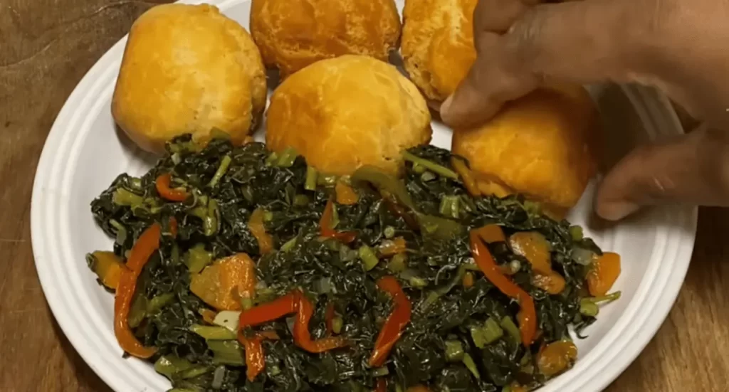 Close-up of calilu cooking in a pot with okra and seasoning