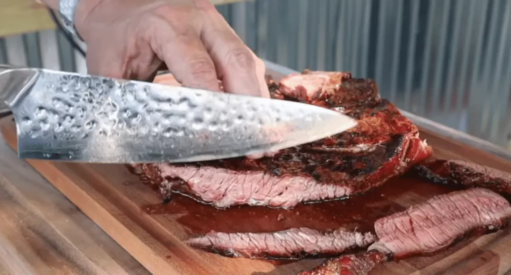 Tender chuck roast sliced to show juicy, well-cooked meat