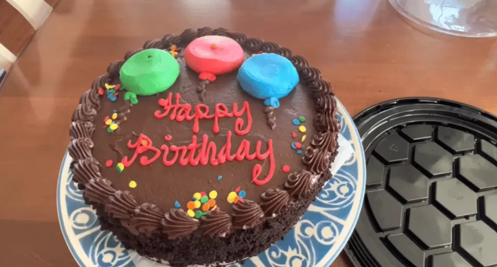 Whole Costco Chocolate Cake with decorative frosting