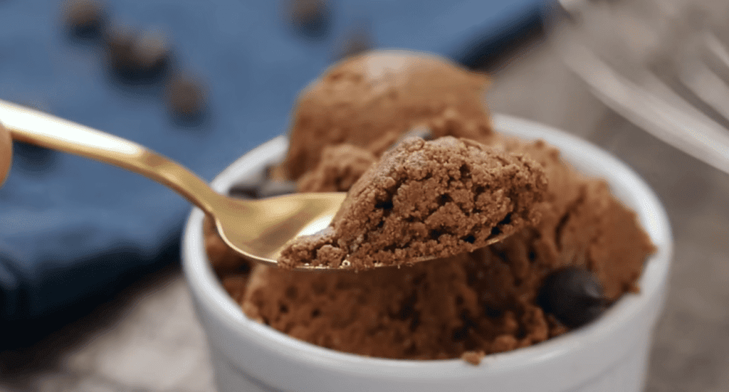 Assorted protein cookies on a plate, featuring flavors like peanut butter and chocolate. Ideal for a post-workout boost or a satisfying treat.