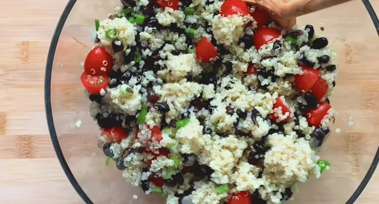 Colorful Zesty Quinoa Salad with fresh vegetables, herbs, and citrus.