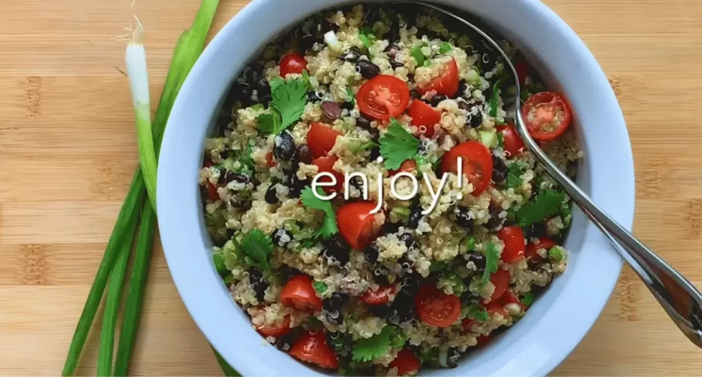 Colorful Zesty Quinoa Salad with fresh vegetables, herbs, and citrus.